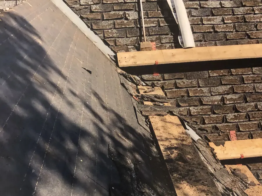 Brick chimney with new flashing and underlayment during a chimney repair